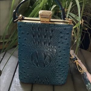 Blue ostrich style vegan leather purse with blingy clasp.